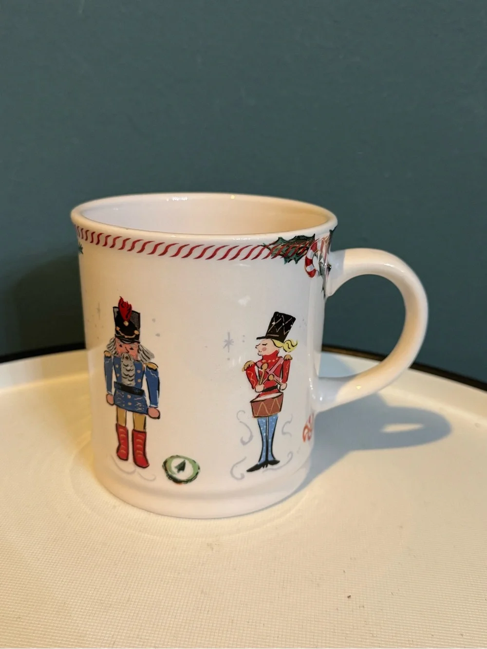 Sur La Table White Ceramic Nutcracker Holiday Mug with Red and Blue Accents